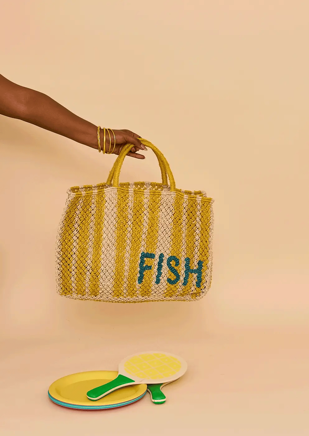 Yellow and cream striped macrame bag with Fish 'n' Chips in blue writing